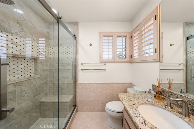950 Chantel Dr, Corona, CA 92879 - bathroom with vanity, a shower stall, toilet, tile patterned flooring, and tile walls