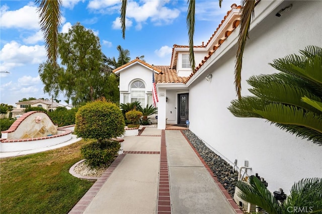 950 Chantel Dr, Corona, CA 92879 - view of exterior entry featuring stucco siding and a tile roof