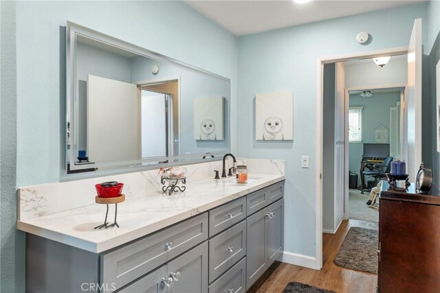 46 Lincoln Ct, Buena Park, CA 90620 - bathroom featuring wood finished floors, vanity, and baseboards