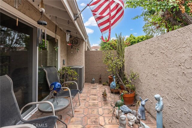 46 Lincoln Ct, Buena Park, CA 90620 - fenced backyard featuring central AC unit and a patio area