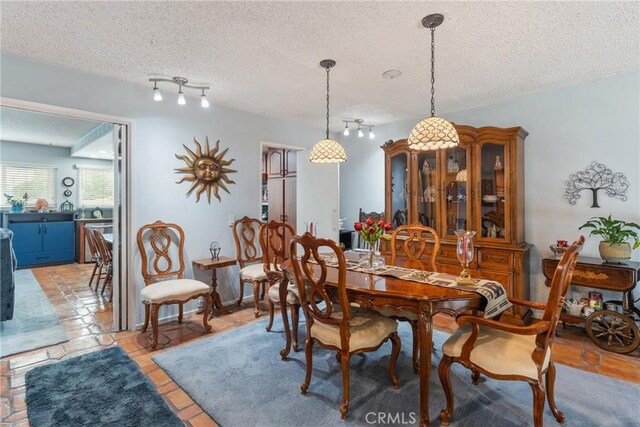 46 Lincoln Ct, Buena Park, CA 90620 - dining room with a textured ceiling and track lighting