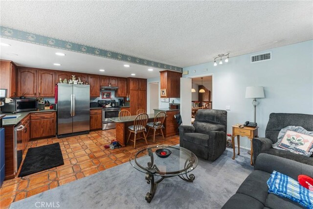 46 Lincoln Ct, Buena Park, CA 90620 - living area featuring recessed lighting, a textured ceiling, and light tile patterned flooring