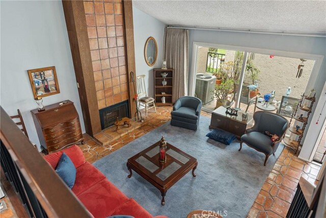 46 Lincoln Ct, Buena Park, CA 90620 - tiled living room featuring a textured ceiling and a tile fireplace