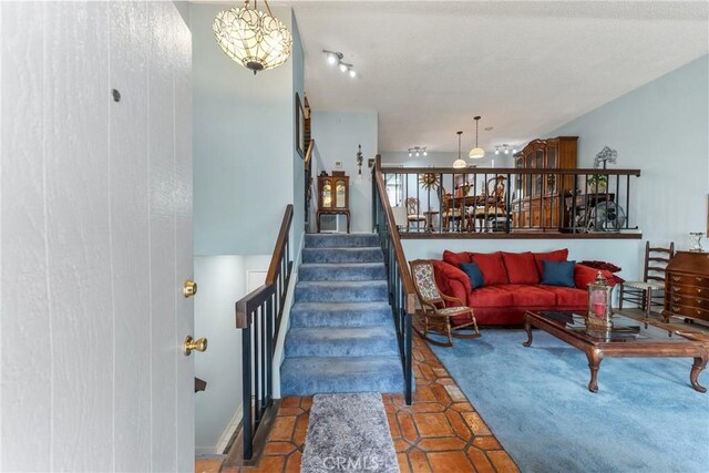 46 Lincoln Ct, Buena Park, CA 90620 - tiled living room featuring stairs and a chandelier