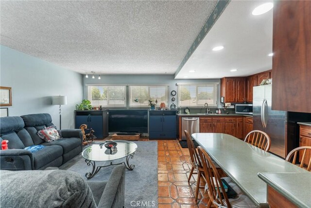 46 Lincoln Ct, Buena Park, CA 90620 - living area featuring a textured ceiling, light tile patterned flooring, and recessed lighting
