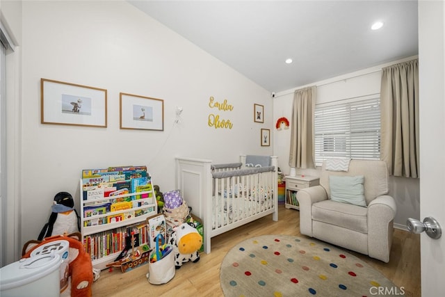 5740 S Glennie Ln Unit C, Los Angeles, CA 90016 - bedroom featuring wood finished floors, recessed lighting, a crib, and baseboards