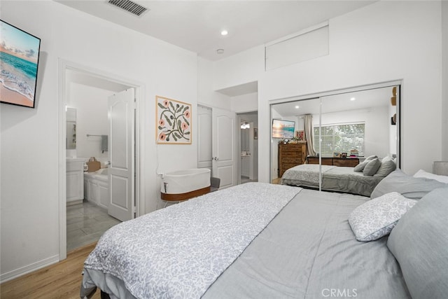 5740 S Glennie Ln Unit C, Los Angeles, CA 90016 - bedroom with a closet, wood finished floors, recessed lighting, baseboards, and connected bathroom