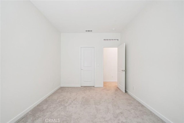 16773 Grapefruit Ln, Fontana, CA 92336 - unfurnished bedroom with light carpet and baseboards
