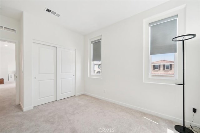 16773 Grapefruit Ln, Fontana, CA 92336 - unfurnished bedroom with carpet flooring, a closet, and baseboards