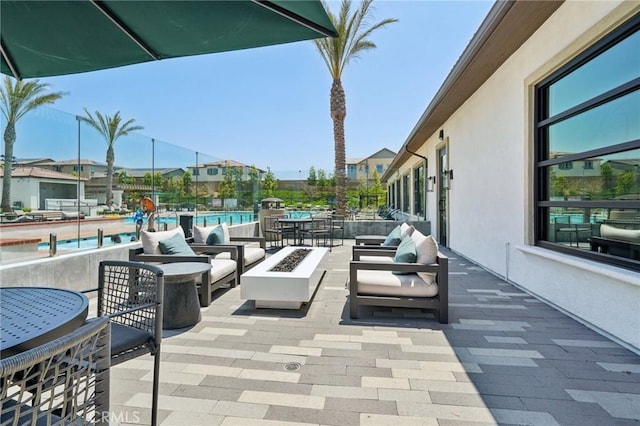 16773 Grapefruit Ln, Fontana, CA 92336 - view of patio / terrace with an outdoor living space with a fire pit and a community pool