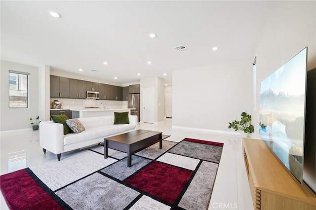 16773 Grapefruit Ln, Fontana, CA 92336 - living room featuring baseboards and recessed lighting