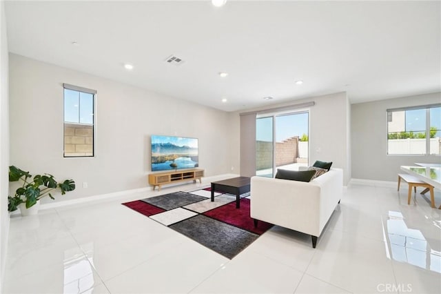 16773 Grapefruit Ln, Fontana, CA 92336 - tiled living room with baseboards and recessed lighting