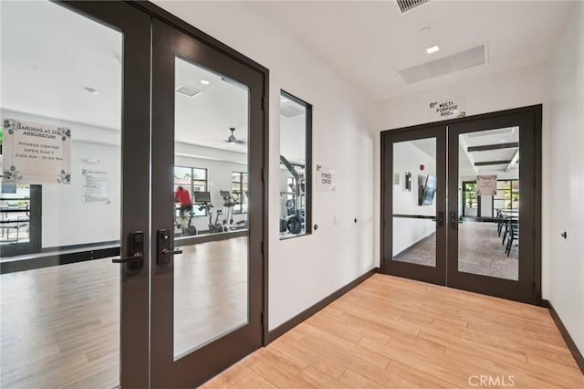 16773 Grapefruit Ln, Fontana, CA 92336 - doorway with french doors and light wood-type flooring