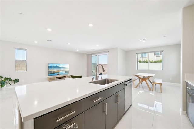 16773 Grapefruit Ln, Fontana, CA 92336 - kitchen with dishwasher, light countertops, plenty of natural light, a center island with sink, and recessed lighting