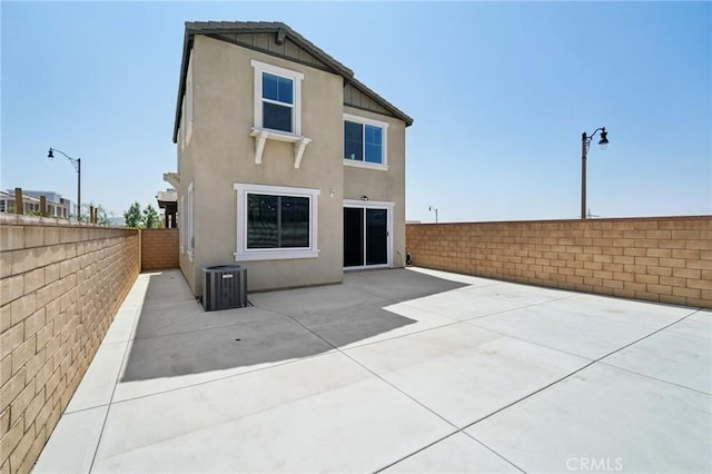 16773 Grapefruit Ln, Fontana, CA 92336 - back of house featuring stucco siding, a fenced backyard, and a patio area