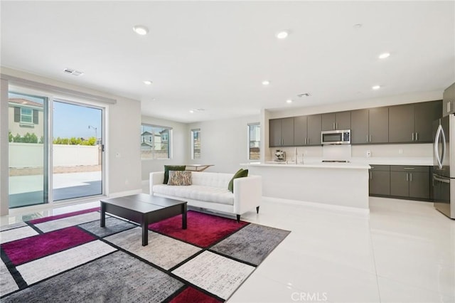 16773 Grapefruit Ln, Fontana, CA 92336 - living room featuring recessed lighting and baseboards