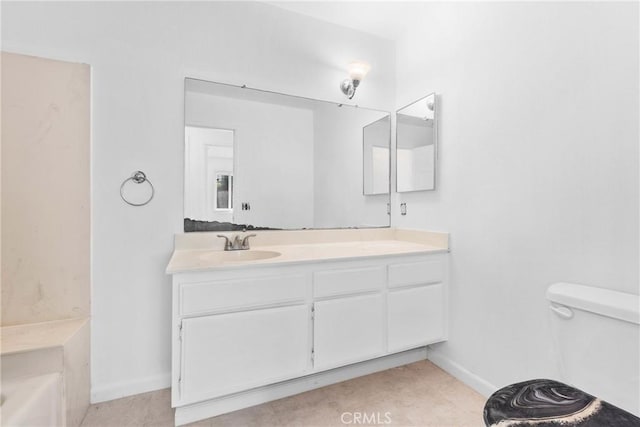 30369 Colina Verde St, Temecula, CA 92592 - bathroom with vanity, toilet, a tub to relax in, and baseboards