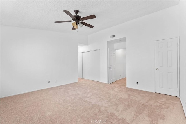 30369 Colina Verde St, Temecula, CA 92592 - unfurnished bedroom with light colored carpet, a textured ceiling, baseboards, a closet, and ceiling fan