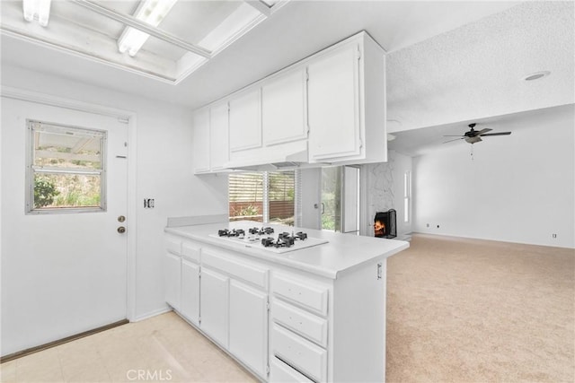 30369 Colina Verde St, Temecula, CA 92592 - kitchen with white gas stovetop, a peninsula, plenty of natural light, and light countertops