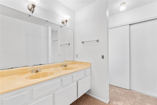30369 Colina Verde St, Temecula, CA 92592 - bathroom featuring double vanity, a textured ceiling, and baseboards