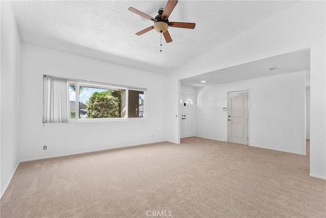 30369 Colina Verde St, Temecula, CA 92592 - spare room featuring carpet flooring, ceiling fan, vaulted ceiling, a textured ceiling, and baseboards