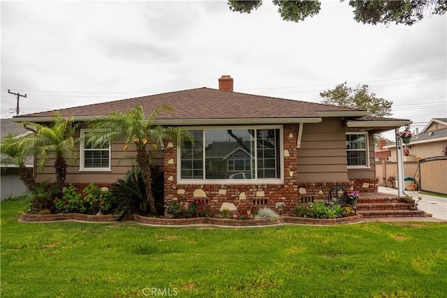 6214 Hungerford St, Lakewood, CA 90713 - view of front facade with a chimney, a patio area, and a shingled roof