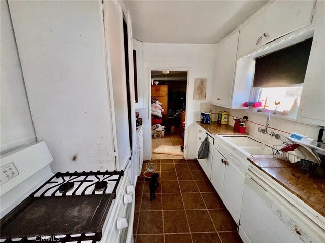 21835 Dotame Ave, Apple Valley, CA 92307 - kitchen featuring white appliances, a sink, white cabinets, and dark tile patterned flooring