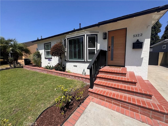 5322 Briercrest Ave, Lakewood, CA 90713 - view of front of home with stucco siding and a front yard