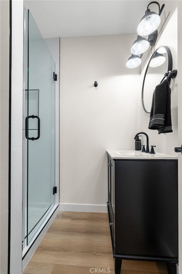 5322 Briercrest Ave, Lakewood, CA 90713 - bathroom featuring vanity, a stall shower, and wood finished floors