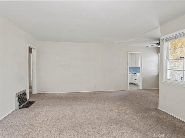 517 N Avon St, Burbank, CA 91505 - unfurnished living room featuring a ceiling fan, light colored carpet, and baseboards