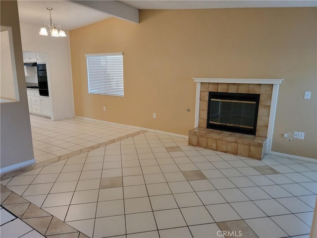 733 Piccadilly, Hemet, CA 92544 - unfurnished living room with light tile patterned floors, baseboards, a chandelier, and a tiled fireplace