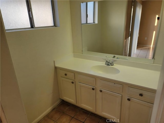 733 Piccadilly, Hemet, CA 92544 - bathroom with healthy amount of natural light, tile patterned floors, vanity, and baseboards