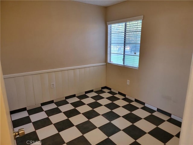 733 Piccadilly, Hemet, CA 92544 - spare room with a wainscoted wall
