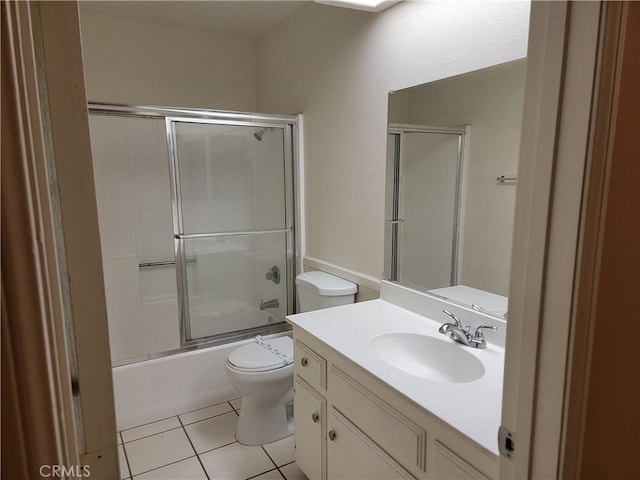 733 Piccadilly, Hemet, CA 92544 - full bathroom featuring toilet, vanity, combined bath / shower with glass door, and tile patterned floors