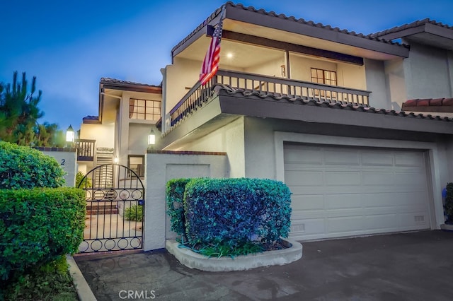2209 W 25th St Unit 2, San Pedro, CA 90732 - mediterranean / spanish-style house with a garage, stucco siding, and a tile roof