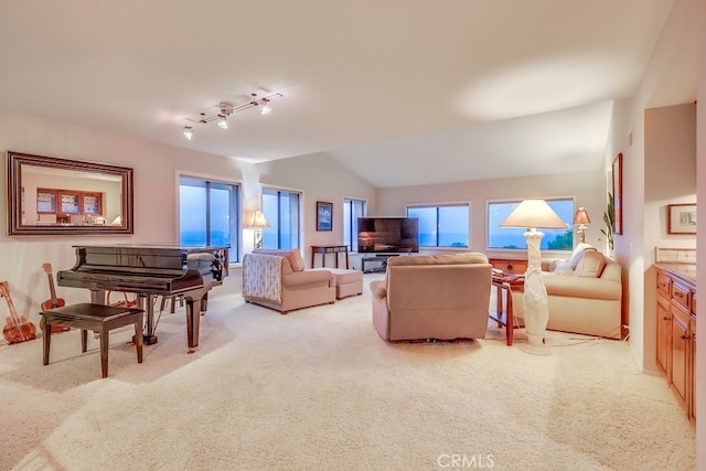 2209 W 25th St Unit 2, San Pedro, CA 90732 - living area featuring light colored carpet, lofted ceiling, and rail lighting