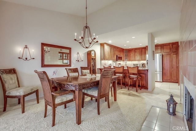 2209 W 25th St Unit 2, San Pedro, CA 90732 - dining space with light carpet, recessed lighting, a chandelier, light tile patterned floors, and a high ceiling