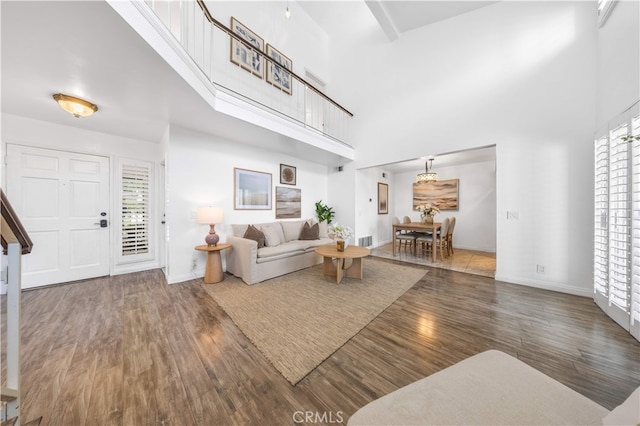 1665 Bridgeport, West Covina, CA 91791 - living room featuring a towering ceiling and wood finished floors