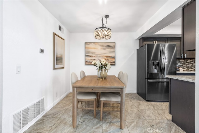 1665 Bridgeport, West Covina, CA 91791 - dining space featuring baseboards and a chandelier