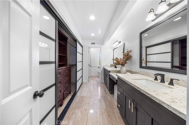 1665 Bridgeport, West Covina, CA 91791 - bathroom with vanity, recessed lighting, and marble finish flooring