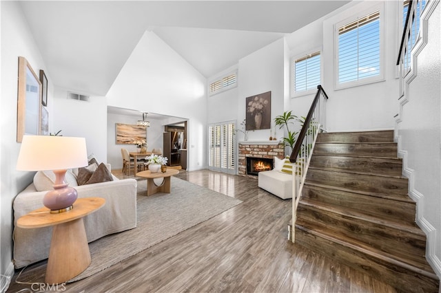 1665 Bridgeport, West Covina, CA 91791 - living area featuring stairs, wood finished floors, a fireplace, and high vaulted ceiling