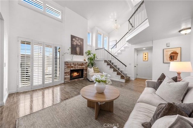 1665 Bridgeport, West Covina, CA 91791 - living room featuring a high ceiling, wood finished floors, healthy amount of natural light, stairway, and a chandelier