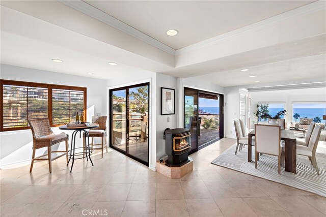 408 Pasadena Ct Unit L, San Clemente, CA 92672 - dining space with a wood stove, crown molding, recessed lighting, baseboards, and light tile patterned floors