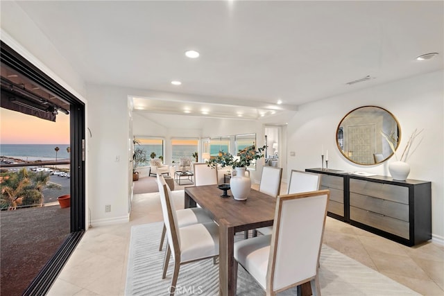408 Pasadena Ct Unit L, San Clemente, CA 92672 - dining area with light tile patterned floors, recessed lighting, baseboards, and a water view