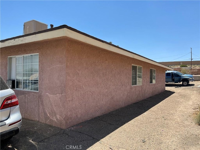 255 W Grace St, Barstow, CA 92311 - view of side of property featuring stucco siding