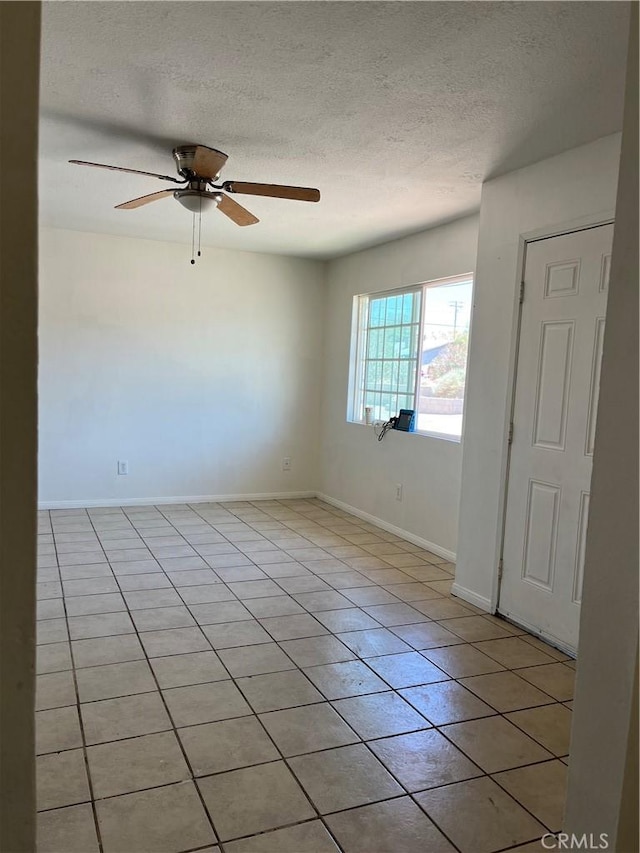 255 W Grace St, Barstow, CA 92311 - unfurnished room featuring light tile patterned floors, a textured ceiling, and ceiling fan