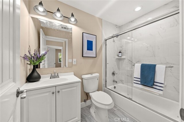 555 N Meridian Ave, San Bernardino, CA 92410 - full bathroom featuring shower / bath combination with glass door and vanity
