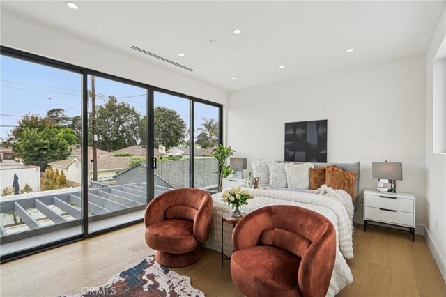 2227 N Lamer St, Burbank, CA 91504 - bedroom with access to outside, wood finished floors, and recessed lighting