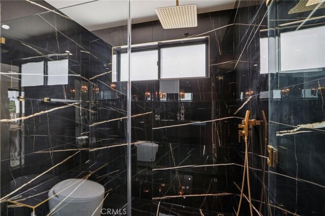 2227 N Lamer St, Burbank, CA 91504 - bathroom featuring toilet, a shower stall, and tile walls