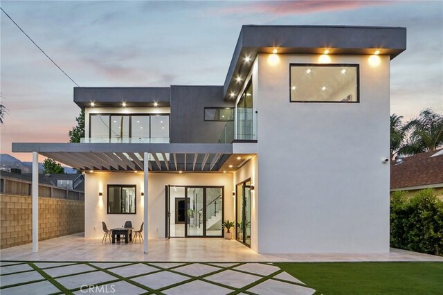 2227 N Lamer St, Burbank, CA 91504 - back of property at dusk with a patio area and stucco siding
